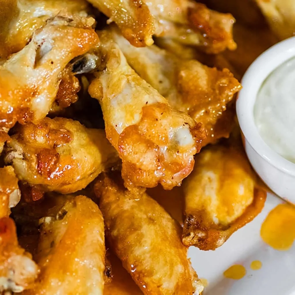 Keto Buffalo Chicken Wings served with celery and ranch dipping sauce