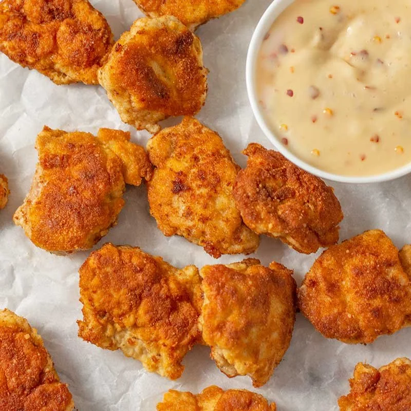 Delicious Keto Chicken Nuggets served on a plate with dipping sauce