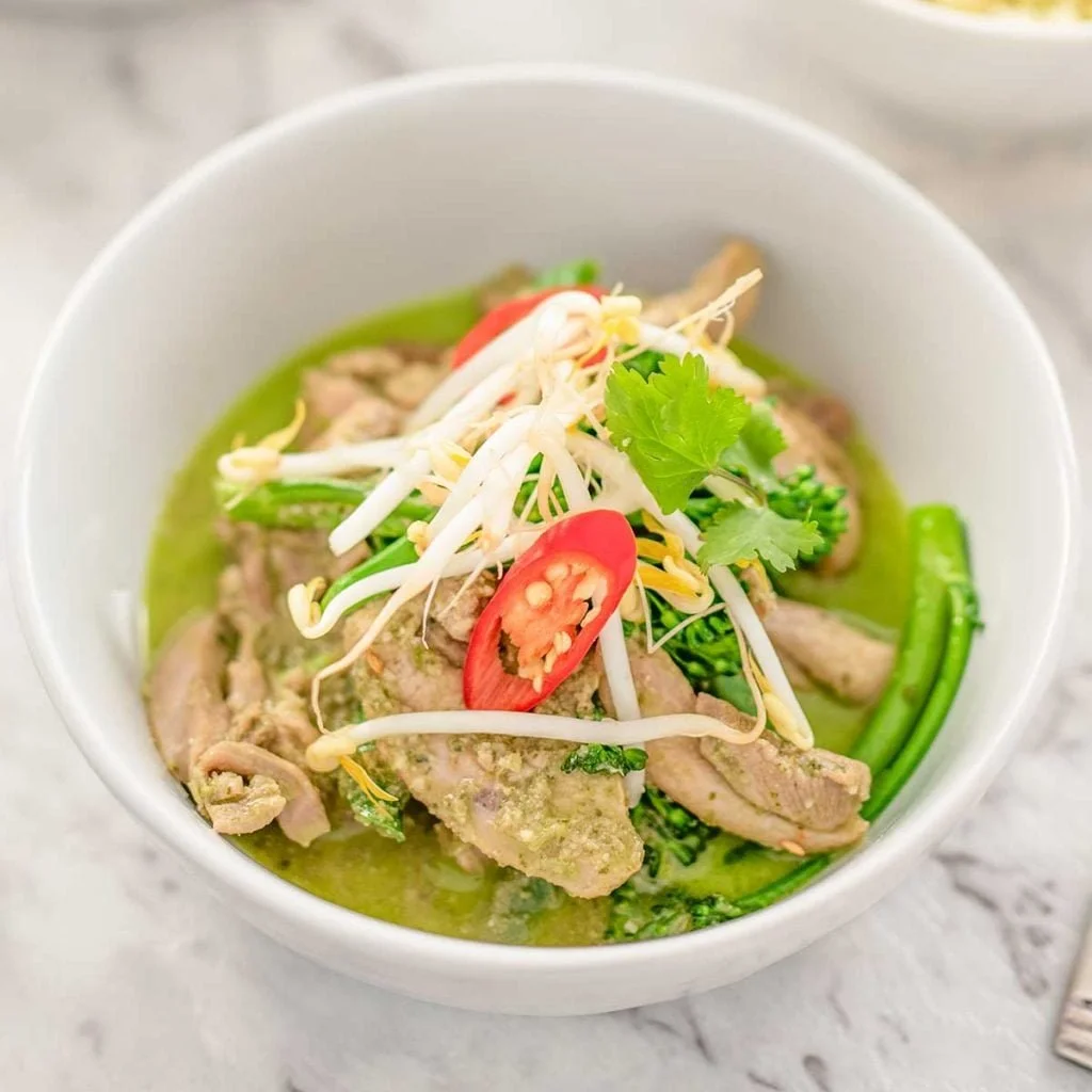 Keto Thai Green Curry with Chicken served in a bowl with fresh cilantro